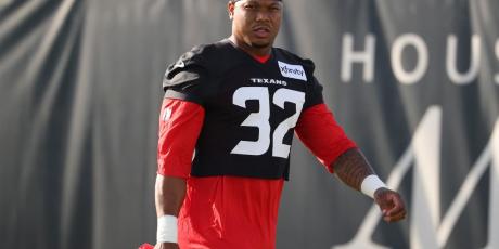 David Montgomery camp carrying helmet