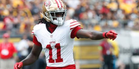 brandon aiyuk pointing white jersey