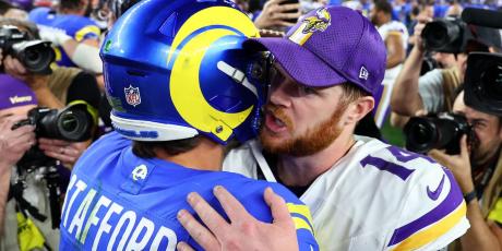 Matthew Stafford and Sam Darnold hug