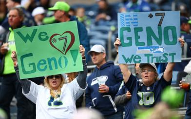 seahawks fans with Geno Smith signs 