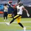 diontae johnson white jersey holding up ball