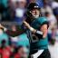trevor lawrence throwing teal jersey