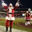santa and cheerleaders on field 