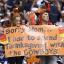 cowboys fans with thanksgiving sign 