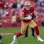 christian mccaffrey running red jersey