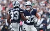 javonte williams jake ferguson celebrate