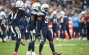 chargers defensive players celebrating 