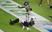 tyler lockett arms out end zone 