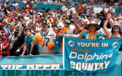 dolphins fans with sign 