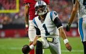 cam newton kneeling and smiling 