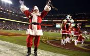 santa and cheerleaders on field 