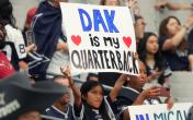 girl holding dak prescott sign 
