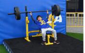 Ram fan kid benchpressing 