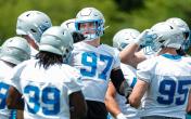 Lions defense huddle OTAs
